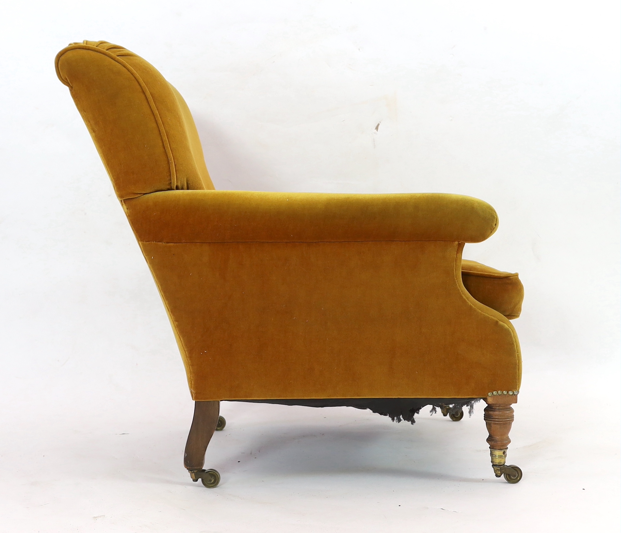 A late Victorian Howard & Sons upholstered armchair